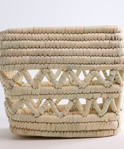 Handmade storage basket in braided straw