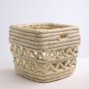 Handmade storage basket in braided straw