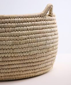 Handmade storage basket in braided wicker