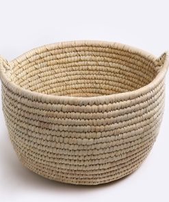 Handmade storage basket in braided wicker